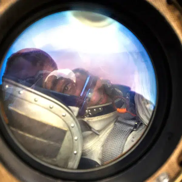 A close-up of astronaut Chris Cassidy through the window of the Soyuz capsule. A close-up view through the circular window of the Soyuz capsule showing NASA Astronaut Chris Cassidy strapped into his seat immediately following a successful landing.