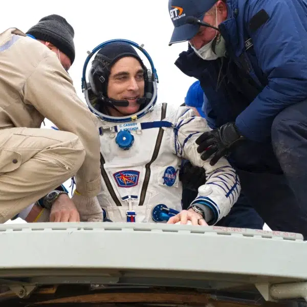 NASA Astronaut and Navy SEAL Chris Cassidy being assisted by recovery teams shortly after his Soyuz MS-16 spacecraft landed in a remote area of Kazakhstan. NASA Astronaut and Navy SEAL Chris Cassidy being assisted by recovery teams shortly after his Soyuz MS-16 spacecraft landed in a remote area of Kazakhstan.