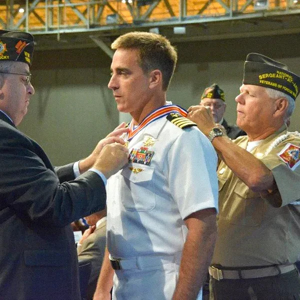 VFW Aeronautics and Aerospace Award Navy SEAL and NASA Astronaut Chris Cassidy receiving the VFW Aeronautics and Aerospace Award from officials at the VFW National Convention in Louisville, Kentucky.