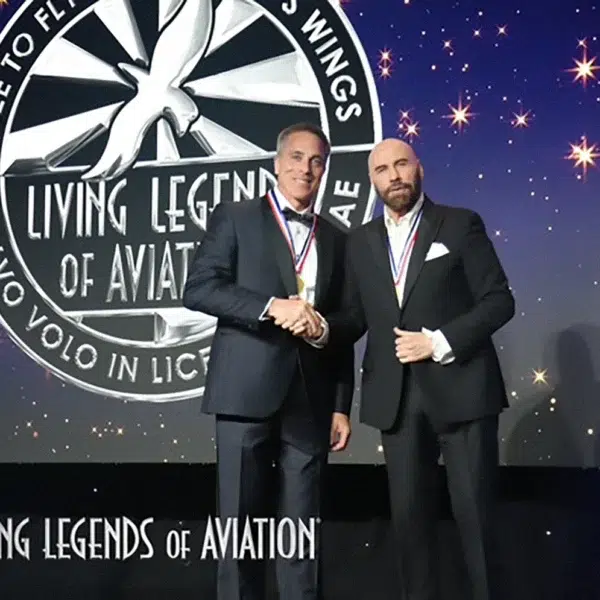 Chris Cassidy and John Travolta at Legends of Aviation event Astronaut Chris Cassidy shaking hands with John Travolta at the Living Legends of Aviation awards ceremony, celebrating a legacy of inspiring leadership in aerospace.