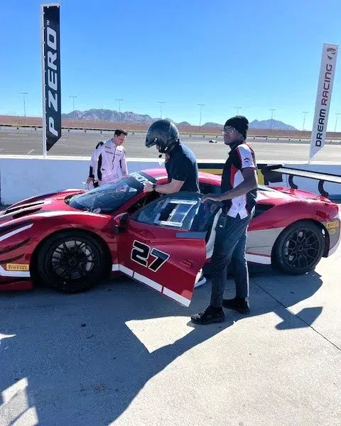 EAL Chris Cassidy entering a red Ferrari race car NASA Astronaut and Navy SEAL Chris Cassidy entering a red Ferrari race car, demonstrating a life-long pursuit of high-performance and technical discovery.